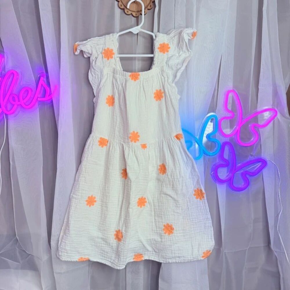White dress with orange flowers